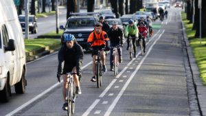 Driver owes a duty to passenger and passing cyclists to warn passenger to prevent cyclist slams into opening car door when exiting vehicle at Australian Open tennis